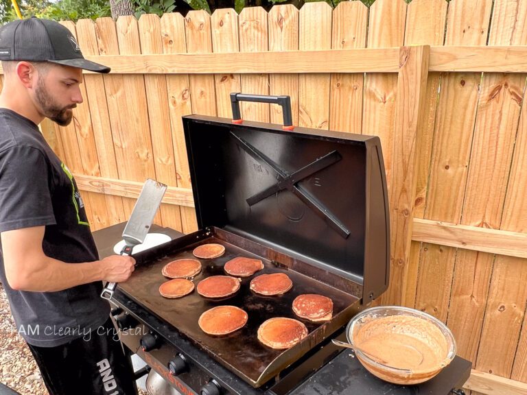 man grilling pancakes