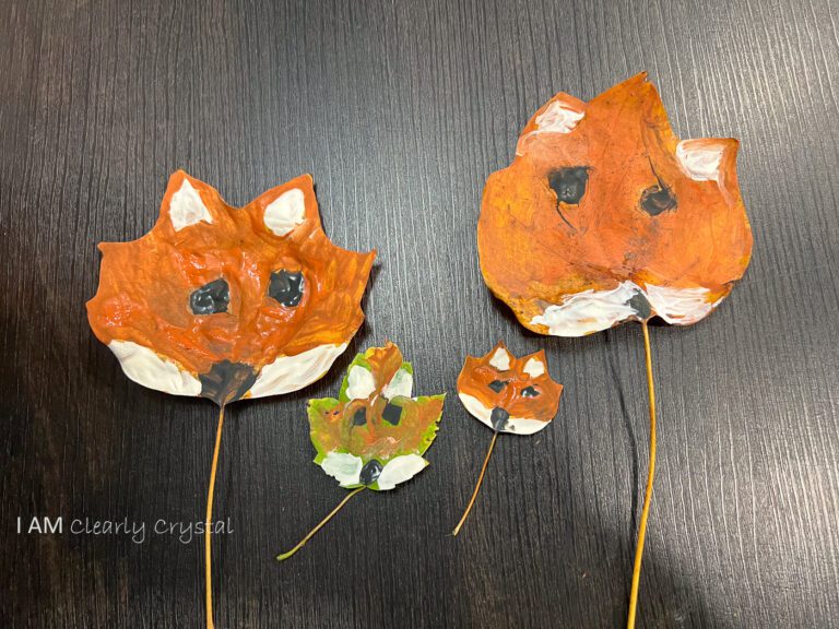 painted leaves with fox faces