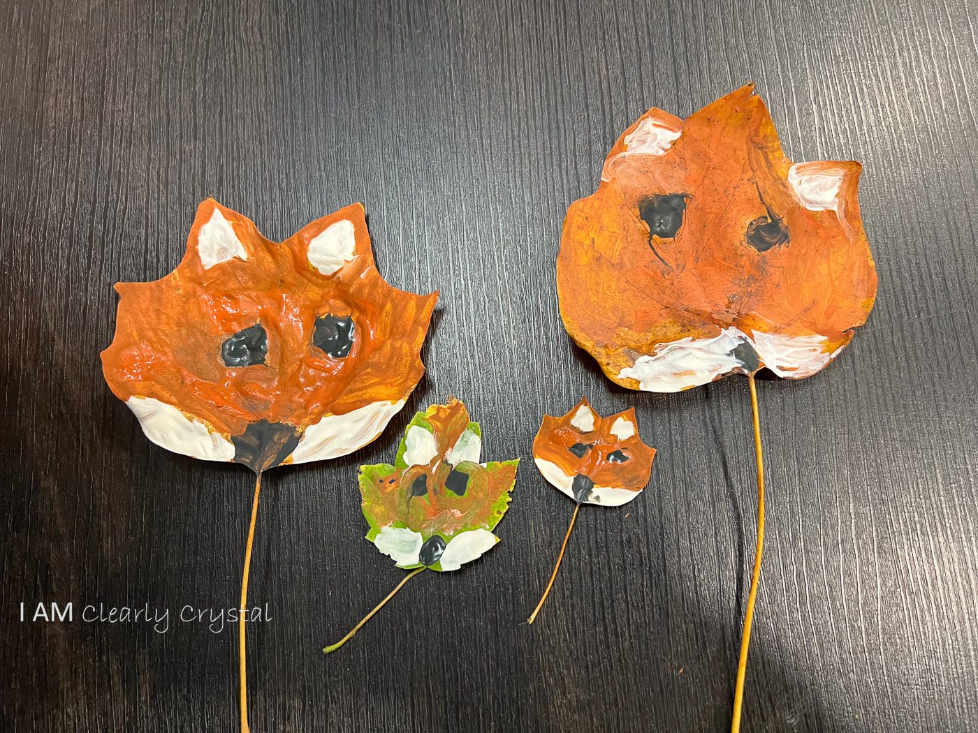 painted leaves with fox faces