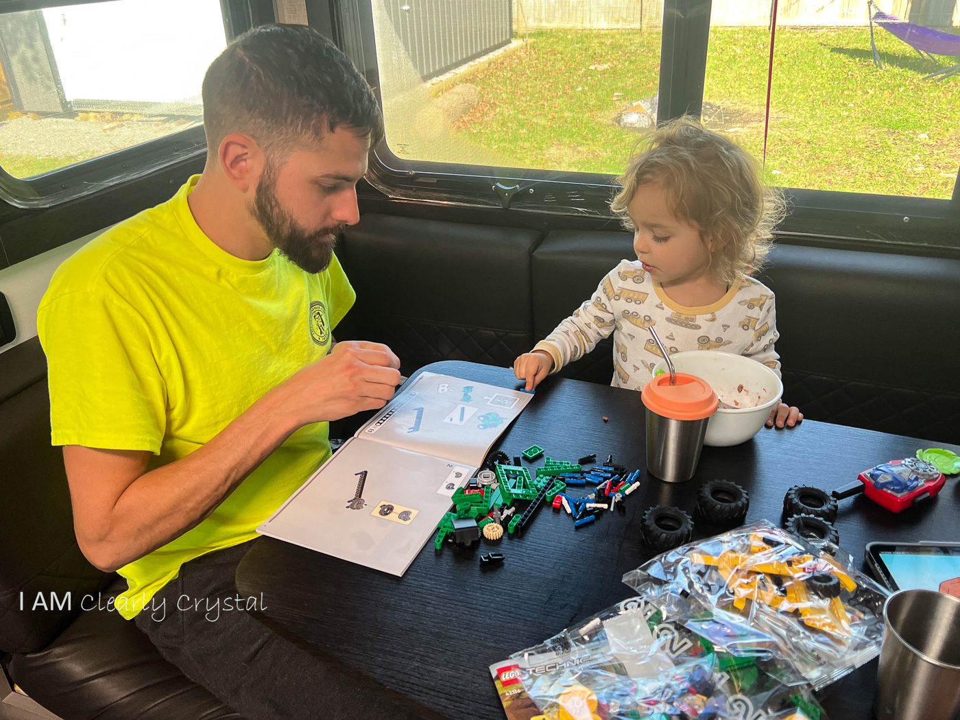 father and son building legos