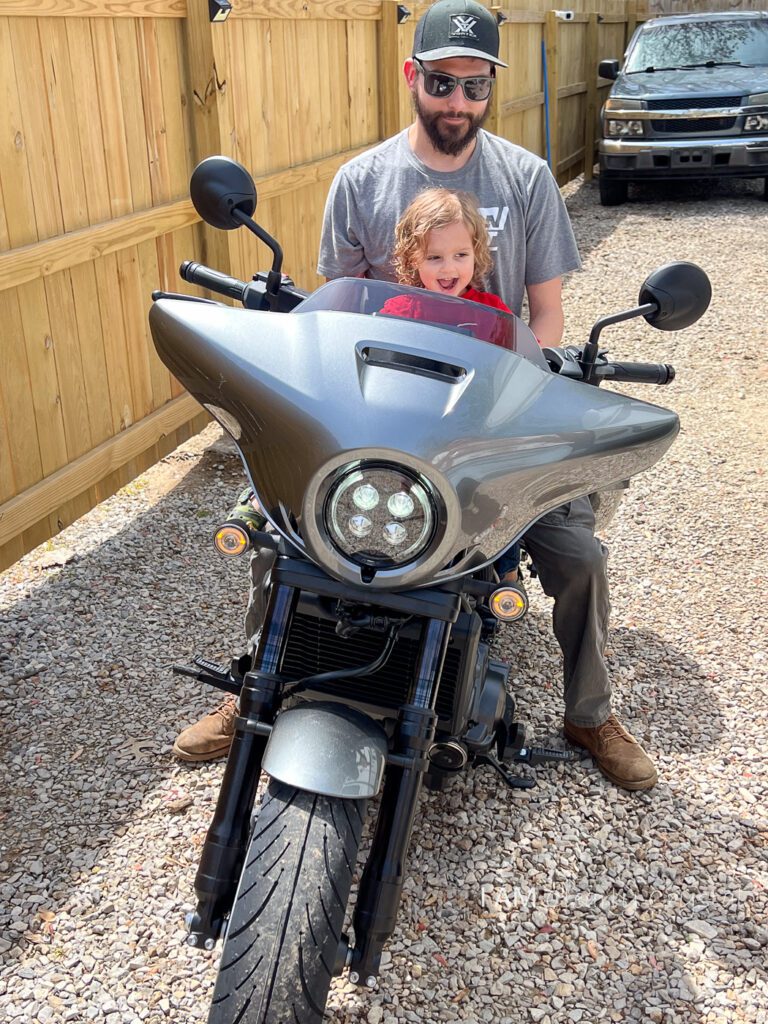 father and son on motorcycle